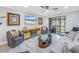 Spacious living room featuring modern furniture, stylish decor, and access to the outdoor patio at 5892 17Th W St # C25, Bradenton, FL 34207