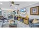 Inviting living room with views to the dining area, stylish decor, and comfortable seating at 5892 17Th W St # C25, Bradenton, FL 34207