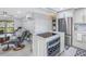 Open-concept living space featuring a modern kitchen island, and comfortable seating area at 5892 17Th W St # C25, Bradenton, FL 34207
