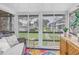 Bright enclosed patio featuring comfortable seating and views of the landscaped surroundings at 5892 17Th W St # C25, Bradenton, FL 34207