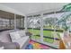 Enclosed patio offers a serene view of the green space and complex landscaping at 5892 17Th W St # C25, Bradenton, FL 34207