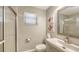 Bathroom featuring frameless glass shower, modern vanity, and decorative mirror at 6079 Ravenwood Dr, Sarasota, FL 34243