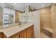 Spa-like bathroom features a vanity, walk-in shower with seating, and neutral tones for relaxation at 6140 Midnight Pass Rd # A10, Sarasota, FL 34242