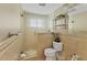 Well-lit bathroom featuring a glass shower door, toilet, and modern fixtures for a comfortable experience at 6140 Midnight Pass Rd # A10, Sarasota, FL 34242
