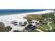 Direct beach access from a meticulously maintained property with covered seating at 6140 Midnight Pass Rd # A10, Sarasota, FL 34242