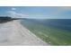 Expansive beach view showcasing the pristine shoreline and shimmering ocean waters at 6140 Midnight Pass Rd # A10, Sarasota, FL 34242