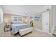 Relaxing bedroom with a queen-size bed, ceiling fan, and plantation shutters, creating a peaceful retreat at 6140 Midnight Pass Rd # A10, Sarasota, FL 34242