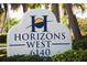 Horizons West community sign, featuring clear address numbers and lush landscaping at 6140 Midnight Pass Rd # A10, Sarasota, FL 34242