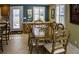 Dining room with a glass top table, seating for six and plantation shutters at 6140 Midnight Pass Rd # A10, Sarasota, FL 34242