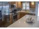 Updated kitchen features stainless steel appliances, custom cabinets, and a bright quartz countertop at 6140 Midnight Pass Rd # A10, Sarasota, FL 34242