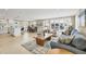 Inviting living area with comfortable seating, a stylish rug, and an open floor plan that includes a kitchen at 6140 Midnight Pass Rd # A10, Sarasota, FL 34242