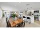 Open living area with a dining table, kitchen island, and comfortable seating, perfect for entertaining at 6140 Midnight Pass Rd # A10, Sarasota, FL 34242