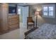 Main bedroom features built in storage, plantation shutters and neutral decor at 6140 Midnight Pass Rd # A10, Sarasota, FL 34242