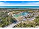 Aerial view of tennis and pickle ball courts near a beautiful beach and waterway in Venice, Florida at 645 Palmetto Dr, Venice, FL 34293