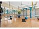 Bright fitness studio with hardwood floors, yoga mats, and large mirrors for workouts at 7849 Wilton Crescent Cir, University Park, FL 34201