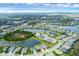 Overhead view of a neighborhood featuring a series of homes surrounding several serene ponds and verdant landscaping at 815 Rosemary Cir, Bradenton, FL 34212