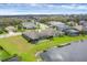A lovely aerial view of homes with ponds in the backyard with lush green lawns at 815 Rosemary Cir, Bradenton, FL 34212