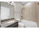 The bathroom features a granite vanity with a vessel sink, a tiled shower-over-tub, and neutral finishes at 815 Rosemary Cir, Bradenton, FL 34212