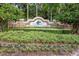 Entrance sign for Greyhawk Landing community, complemented by lush landscaping at 815 Rosemary Cir, Bradenton, FL 34212