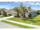 Attractive single-story home featuring a landscaped yard and gray siding, taken from the side at 815 Rosemary Cir, Bradenton, FL 34212