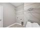 Laundry room with utility sink and wire shelving for ample storage space at 815 Rosemary Cir, Bradenton, FL 34212