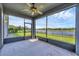 Relaxing screened in patio with beautiful views of the fenced in backyard and pond at 815 Rosemary Cir, Bradenton, FL 34212