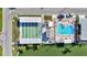 Aerial view of community amenities, showcasing a pool, shuffleboard courts, and nearby waterfront access at 818 50Th Avenue W Ter, Bradenton, FL 34207