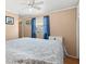 Comfortable bedroom with light-toned walls, a ceiling fan, and bright light from window at 818 50Th Avenue W Ter, Bradenton, FL 34207