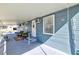 Inviting porch featuring an outdoor seating area and a bright, well-maintained exterior at 818 50Th Avenue W Ter, Bradenton, FL 34207