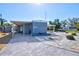 Exterior showcasing the manufactured home with charming curb appeal and a long drive at 818 50Th Avenue W Ter, Bradenton, FL 34207