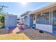 Exterior view shows a small yard with a grill and a shed on the property at 818 50Th Avenue W Ter, Bradenton, FL 34207