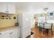 An open kitchen and dining area offers great space for meals and entertaining at 818 50Th Avenue W Ter, Bradenton, FL 34207