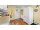 A well-lit kitchen features white appliances, ample cabinet space, and a convenient back door at 818 50Th Avenue W Ter, Bradenton, FL 34207