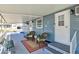 Outdoor patio featuring seating and a covered area, perfect for relaxing and enjoying the outdoors at 818 50Th Avenue W Ter, Bradenton, FL 34207