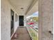 Balcony view from a condo unit with a welcome mat and street view at 102 46Th Avenue W Ter # 402, Bradenton, FL 34207