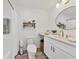 Stylish bathroom with a new vanity and countertops, decorative mirror, and a shower-tub combo at 102 46Th Avenue W Ter # 402, Bradenton, FL 34207