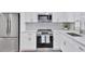 Modern kitchen featuring stainless steel appliances and white cabinets at 102 46Th Avenue W Ter # 402, Bradenton, FL 34207