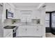 Bright kitchen with white cabinetry and stainless steel appliances at 102 46Th Avenue W Ter # 402, Bradenton, FL 34207