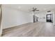 Spacious living room with wood floors and view to updated kitchen at 102 46Th Avenue W Ter # 402, Bradenton, FL 34207
