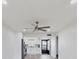 Open-concept with ceiling fan and view of kitchen with stainless appliance package at 102 46Th Avenue W Ter # 402, Bradenton, FL 34207