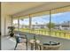Inviting screened patio area, perfect for enjoying the outdoors with comfortable seating and beautiful views at 102 46Th Avenue W Ter # 402, Bradenton, FL 34207