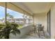 Inviting screened patio area, perfect for enjoying the outdoors with comfortable seating and beautiful views at 102 46Th Avenue W Ter # 402, Bradenton, FL 34207