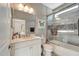 Modern bathroom featuring a glass-enclosed shower and a sleek vanity at 12026 Perennial Pl, Bradenton, FL 34211
