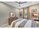 Comfortable bedroom with a dresser, stylish decor, and natural light, creating a relaxing atmosphere at 12026 Perennial Pl, Bradenton, FL 34211