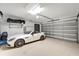 Spacious garage with a car parked inside at 12026 Perennial Pl, Bradenton, FL 34211