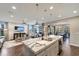 Open-concept kitchen with island seating, modern appliances, and views into the living and dining areas at 12026 Perennial Pl, Bradenton, FL 34211