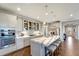 Well-equipped kitchen featuring stainless steel appliances, an island with seating, and modern finishes at 12026 Perennial Pl, Bradenton, FL 34211
