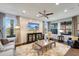 Bright living room with stylish furniture, large windows, and a flat-screen TV at 12026 Perennial Pl, Bradenton, FL 34211