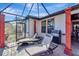 Enjoyable screened patio featuring lounge chairs and a grill at 12026 Perennial Pl, Bradenton, FL 34211