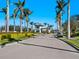 Inviting community entrance with well-manicured landscaping and a welcoming guardhouse at 12404 Golden Sage Dr, Sarasota, FL 34238